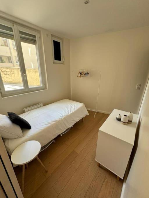 Charmant Appartement Alesia Parigi Esterno foto