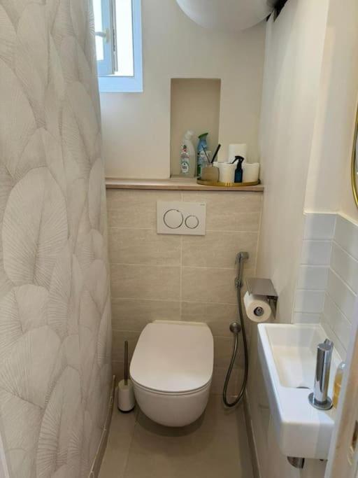 Charmant Appartement Alesia Parigi Esterno foto