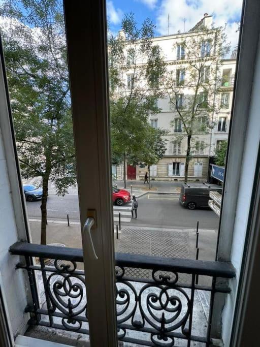 Charmant Appartement Alesia Parigi Esterno foto