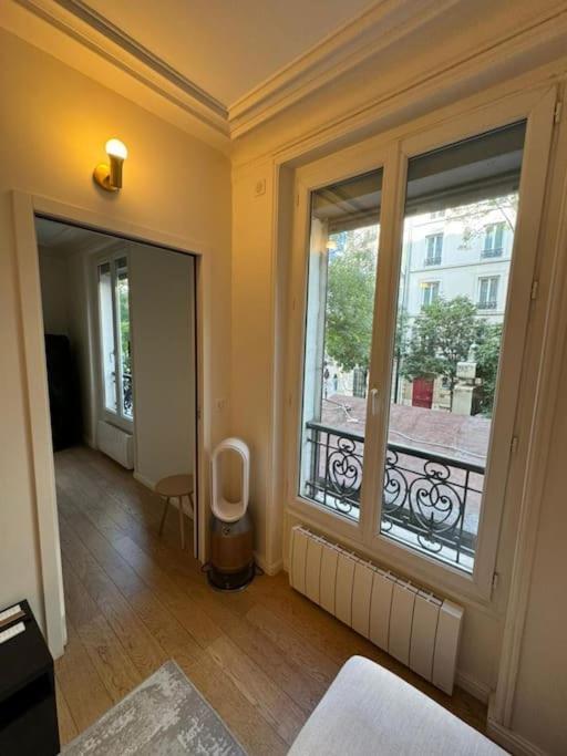Charmant Appartement Alesia Parigi Esterno foto